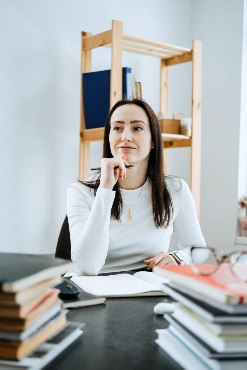 account-balance-definition-female-accountant-working-with-many-books-and-notepads.jpg